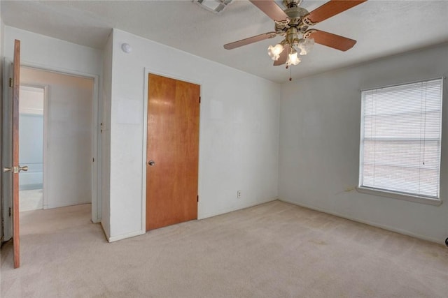 5802 Riley Dr, Corpus Christi, TX 78412 - unfurnished bedroom featuring light carpet and ceiling fan