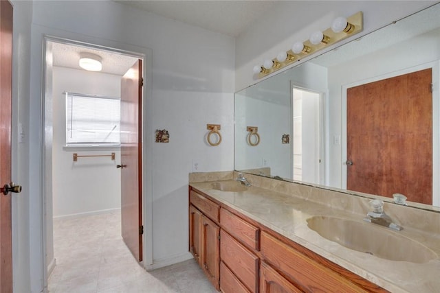 5802 Riley Dr, Corpus Christi, TX 78412 - full bath featuring double vanity and tile patterned floors