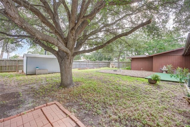 5802 Riley Dr, Corpus Christi, TX 78412 - fenced backyard with a patio
