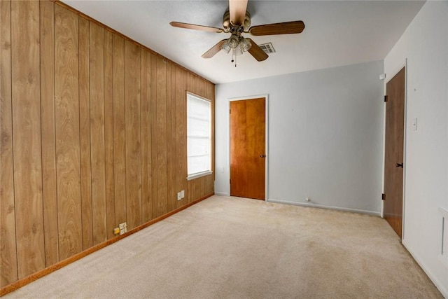 5802 Riley Dr, Corpus Christi, TX 78412 - carpeted empty room featuring ceiling fan and wooden walls