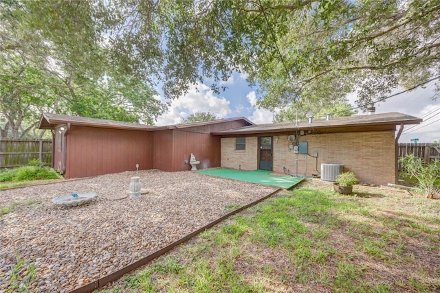 5802 Riley Dr, Corpus Christi, TX 78412 - back of house featuring a patio and brick siding