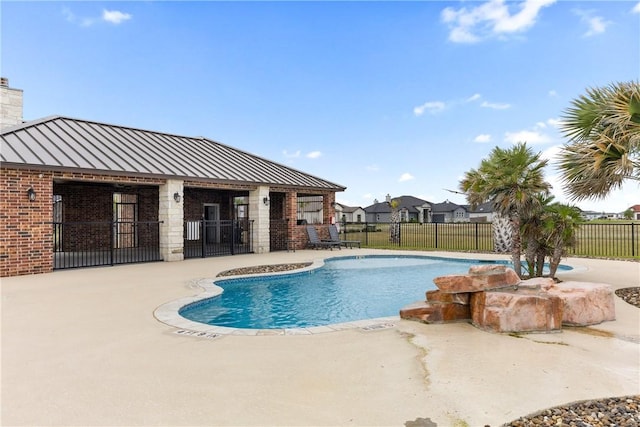 view of swimming pool featuring a patio area