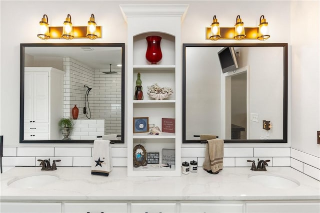 bathroom with decorative backsplash, vanity, and crown molding