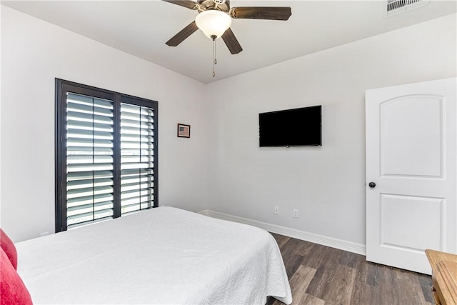 bedroom featuring ceiling fan and dark wood-type flooring