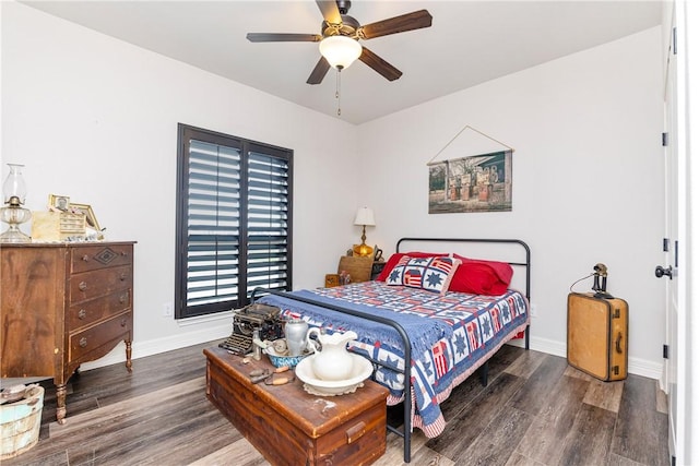 bedroom featuring ceiling fan and dark hardwood / wood-style floors