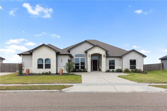 1929 Magnolia Falls Dr, Corpus Christi, TX 78415 - french country style house with stone siding and stucco siding