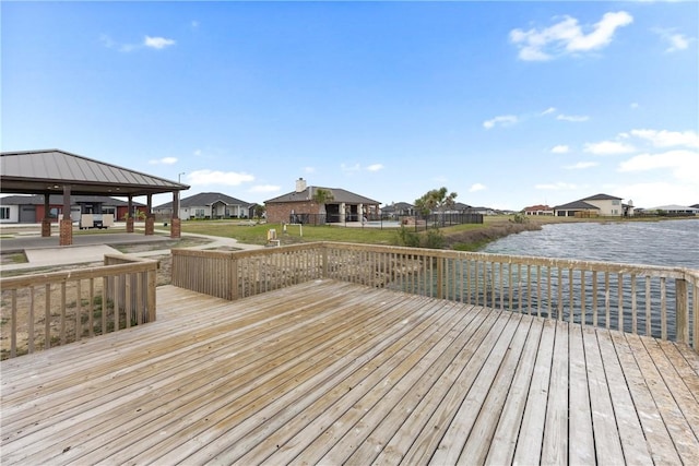 deck featuring a gazebo and a water view