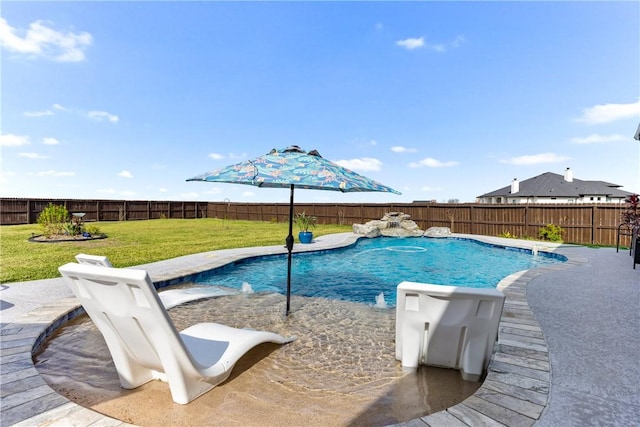 view of pool featuring pool water feature and a yard