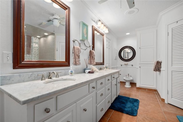 bathroom featuring ceiling fan, vanity, crown molding, and tile patterned flooring