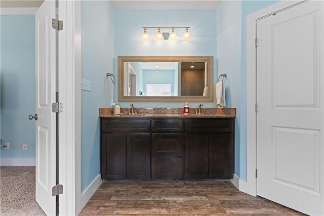 7338 Allman Dr, Corpus Christi, TX 78414 - bathroom with double vanity and baseboards