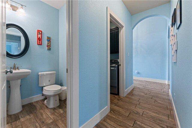 7338 Allman Dr, Corpus Christi, TX 78414 - bathroom featuring wood finished floors and toilet