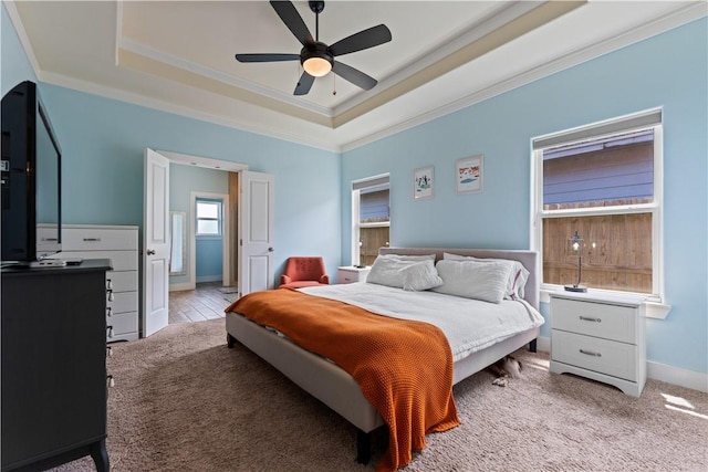 7338 Allman Dr, Corpus Christi, TX 78414 - bedroom with crown molding, a tray ceiling, light carpet, and ceiling fan