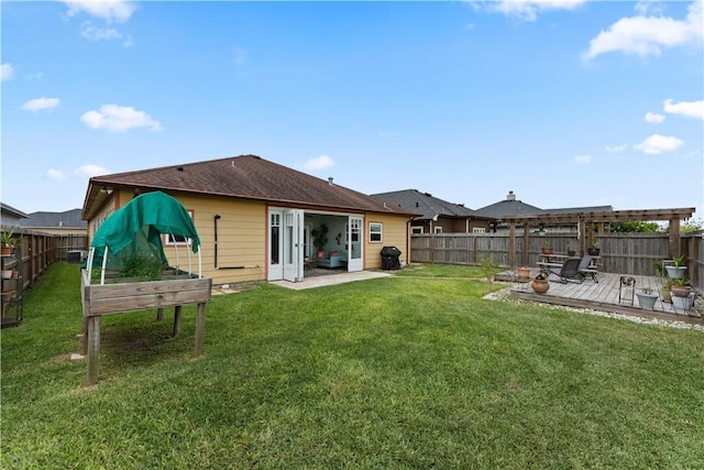 7338 Allman Dr, Corpus Christi, TX 78414 - rear view of property featuring a fenced backyard and a wooden deck