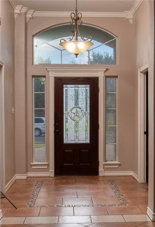 foyer featuring light wood-type flooring and crown molding