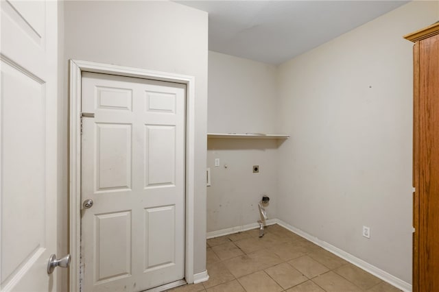 laundry room with electric dryer hookup and light tile patterned floors