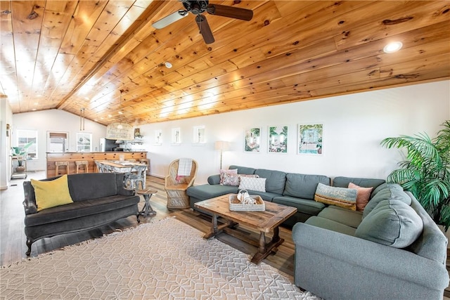 living room with wood ceiling, ceiling fan, light hardwood / wood-style floors, and vaulted ceiling