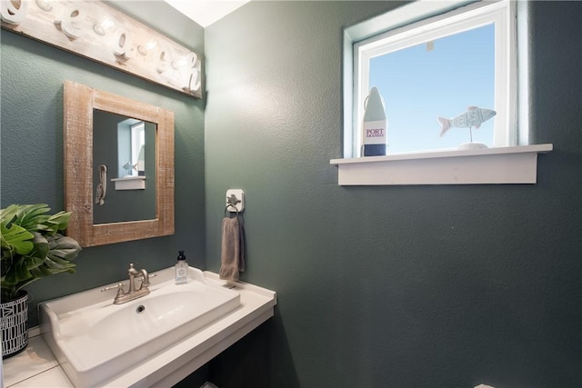 bathroom with tile patterned flooring and sink