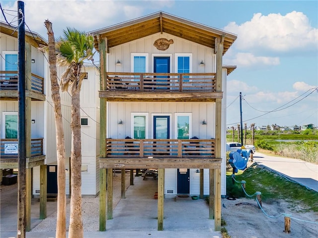 view of front of property featuring a carport and a balcony