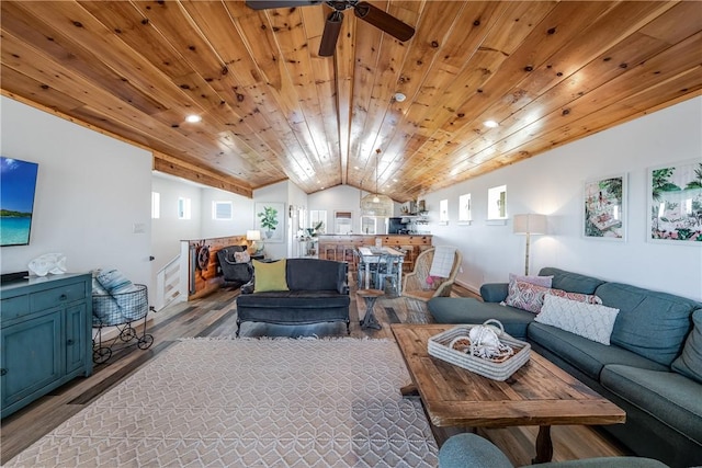 living room with ceiling fan, light wood-type flooring, wood ceiling, and vaulted ceiling