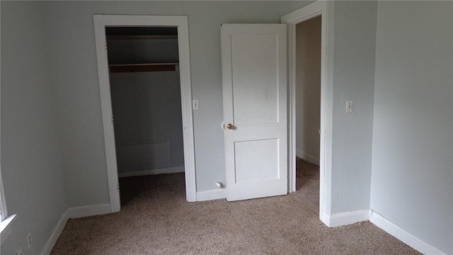 810 S 10th St, Kingsville, TX 78363 - unfurnished bedroom with carpet flooring, a spacious closet, and a closet