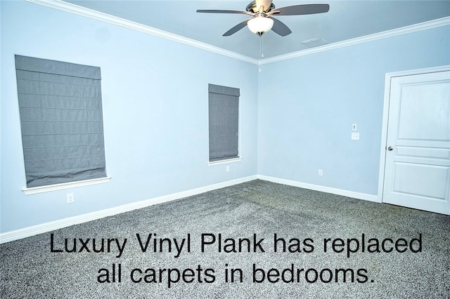 carpeted spare room featuring ceiling fan and crown molding