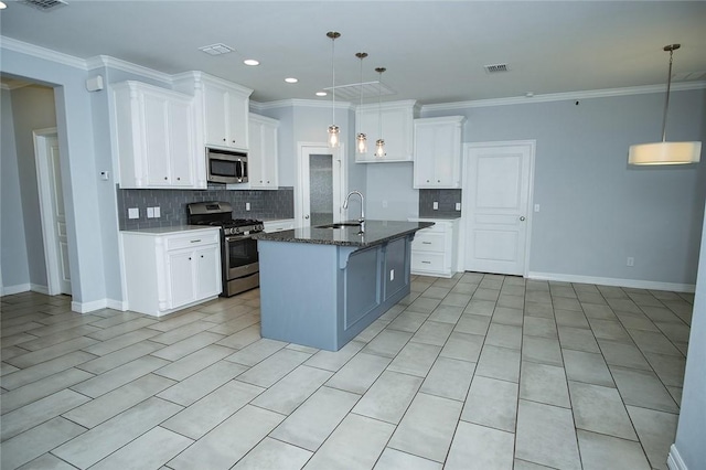 15414 Dyna St, Corpus Christi, TX 78418 - kitchen featuring appliances with stainless steel finishes, backsplash, white cabinets, crown molding, and a kitchen island with sink