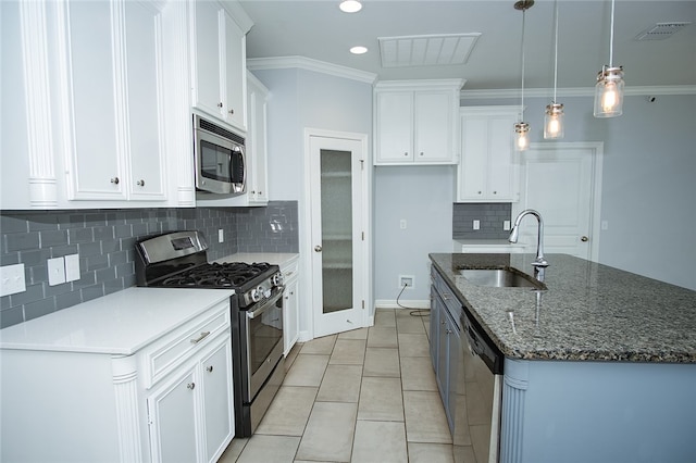 kitchen with white cabinetry, sink, pendant lighting, and appliances with stainless steel finishes