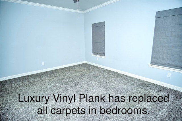 empty room featuring ceiling fan, crown molding, and carpet floors