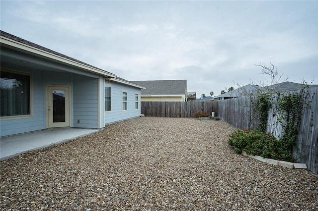 15414 Dyna St, Corpus Christi, TX 78418 - fenced backyard featuring a patio area