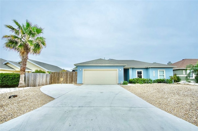 single story home featuring a garage