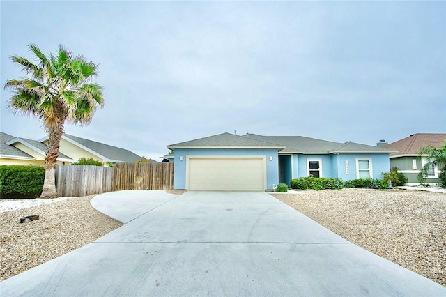 15414 Dyna St, Corpus Christi, TX 78418 - single story home featuring concrete driveway, an attached garage, and stucco siding
