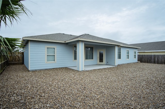 back of property with a patio area