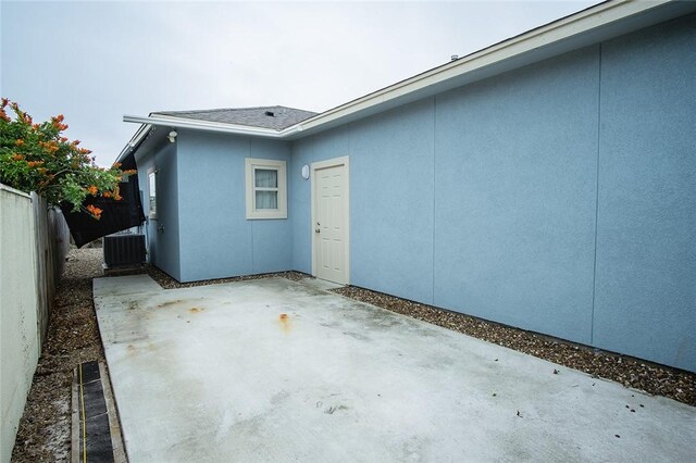15414 Dyna St, Corpus Christi, TX 78418 - view of side of home featuring a patio and stucco siding