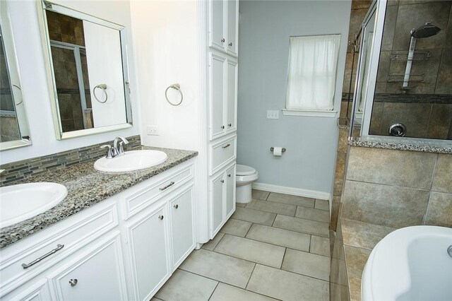 15414 Dyna St, Corpus Christi, TX 78418 - full bathroom featuring tiled shower, double vanity, tile patterned flooring, and a tub