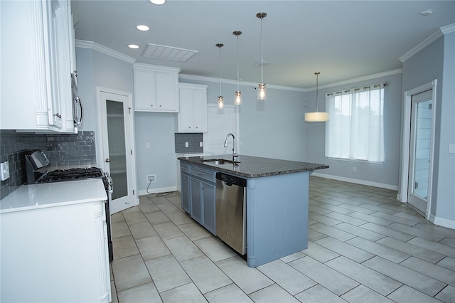 kitchen with stainless steel appliances, white cabinetry, a center island with sink, sink, and pendant lighting