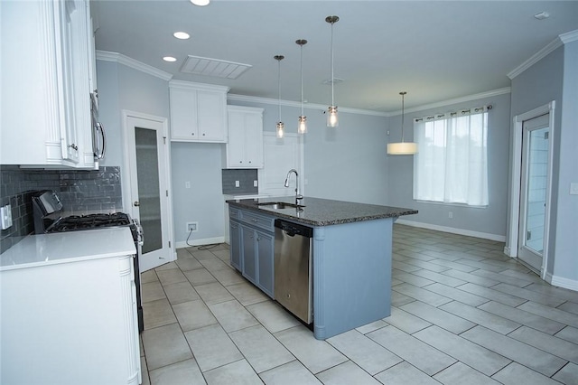 15414 Dyna St, Corpus Christi, TX 78418 - kitchen featuring stainless steel appliances, white cabinets, tasteful backsplash, a kitchen island with sink, and recessed lighting