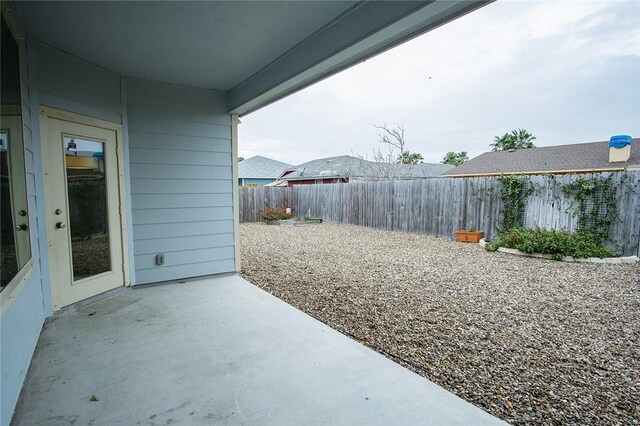 15414 Dyna St, Corpus Christi, TX 78418 - fenced backyard featuring a patio area