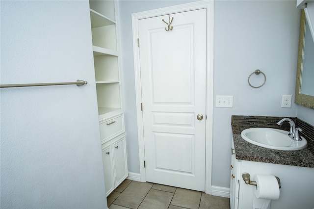 bathroom with vanity and tile patterned flooring