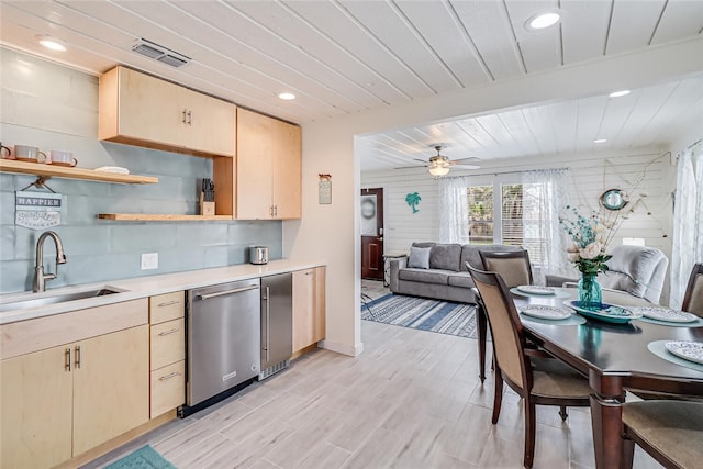 kitchen featuring sink, ceiling fan, dishwasher, refrigerator, and light brown cabinetry