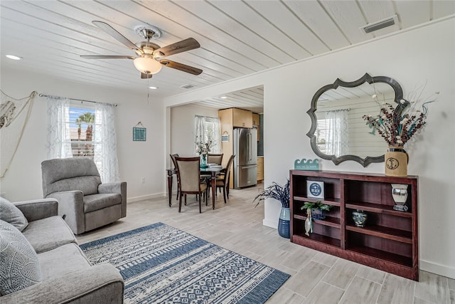 living room featuring wooden ceiling and ceiling fan