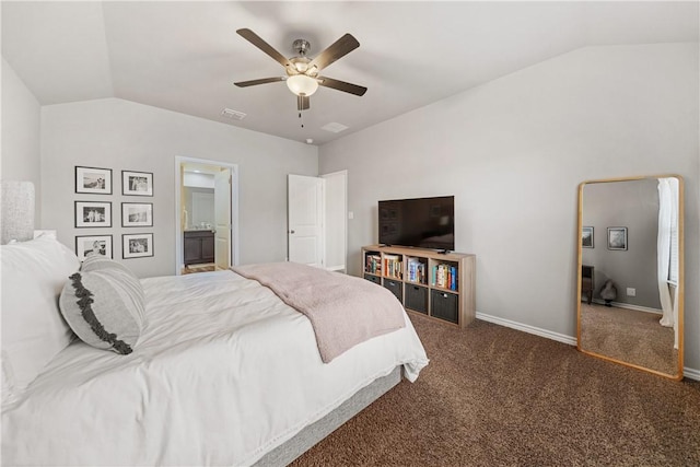 carpeted bedroom with vaulted ceiling, ceiling fan, and ensuite bathroom