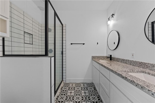 4209 Walnut Hills Dr, Corpus Christi, TX 78413 - bathroom with a shower stall, double vanity, baseboards, and tile patterned flooring