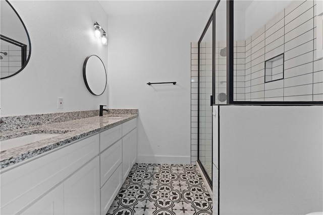4209 Walnut Hills Dr, Corpus Christi, TX 78413 - bathroom featuring a shower stall, double vanity, and baseboards