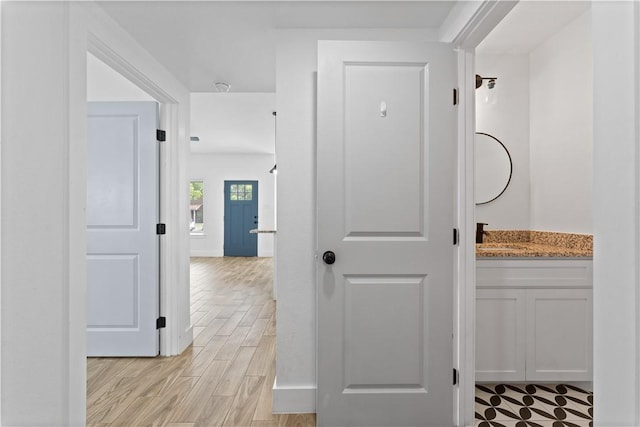 4209 Walnut Hills Dr, Corpus Christi, TX 78413 - corridor featuring light wood-style floors and baseboards