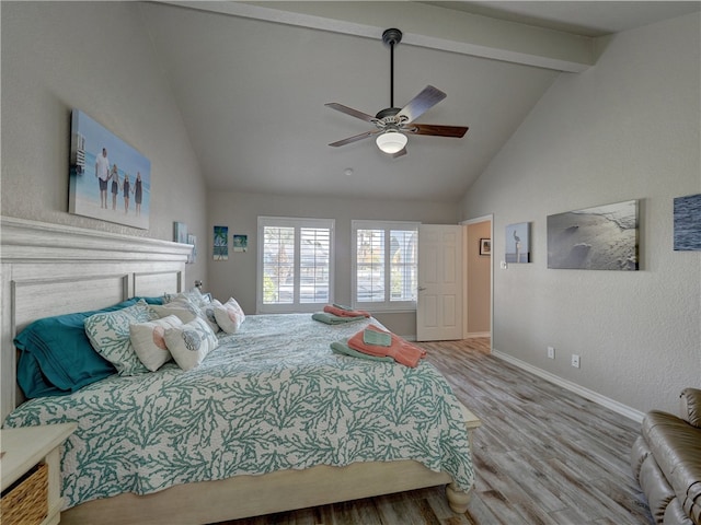 bedroom featuring beam ceiling, high vaulted ceiling, light wood-type flooring, and ceiling fan