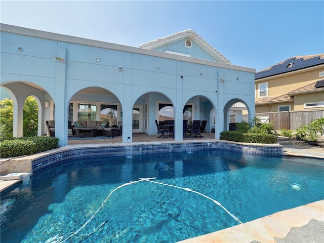 view of swimming pool featuring an outdoor living space and a patio area