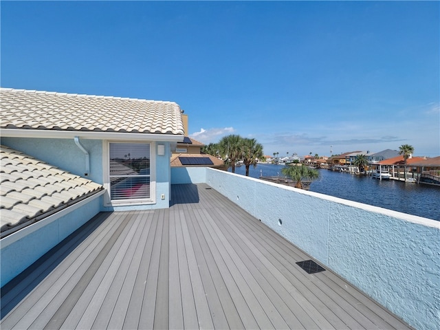 wooden deck with a water view