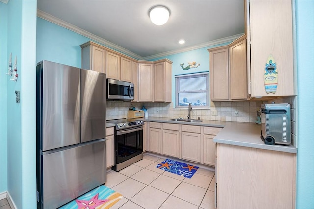 kitchen featuring crown molding, stainless steel appliances, a sink, and light brown cabinetry