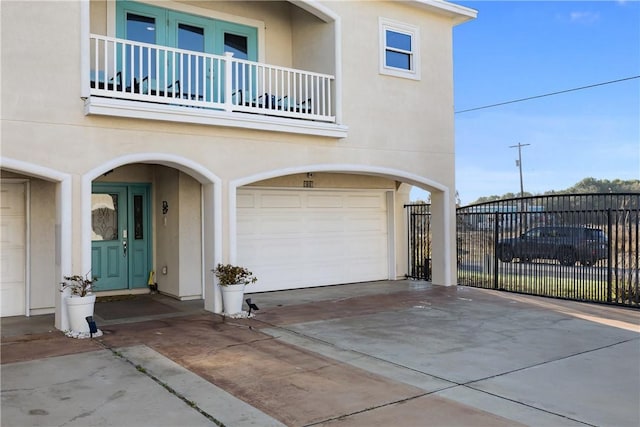 exterior space with fence and concrete driveway