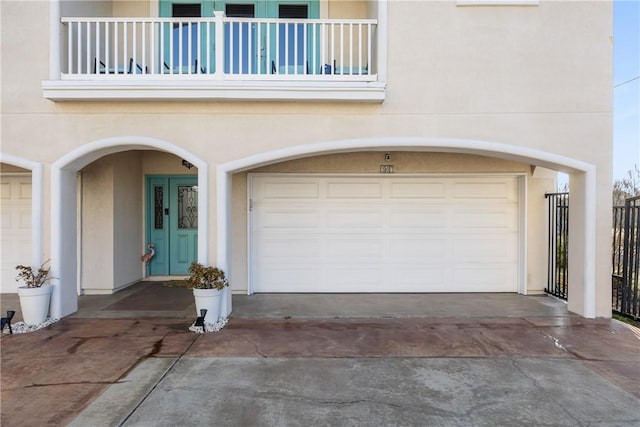 garage with concrete driveway